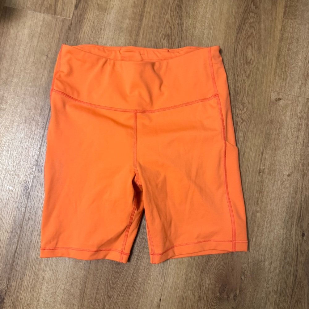 Athleta Women's Orange Biker Shorts with pockets size medium